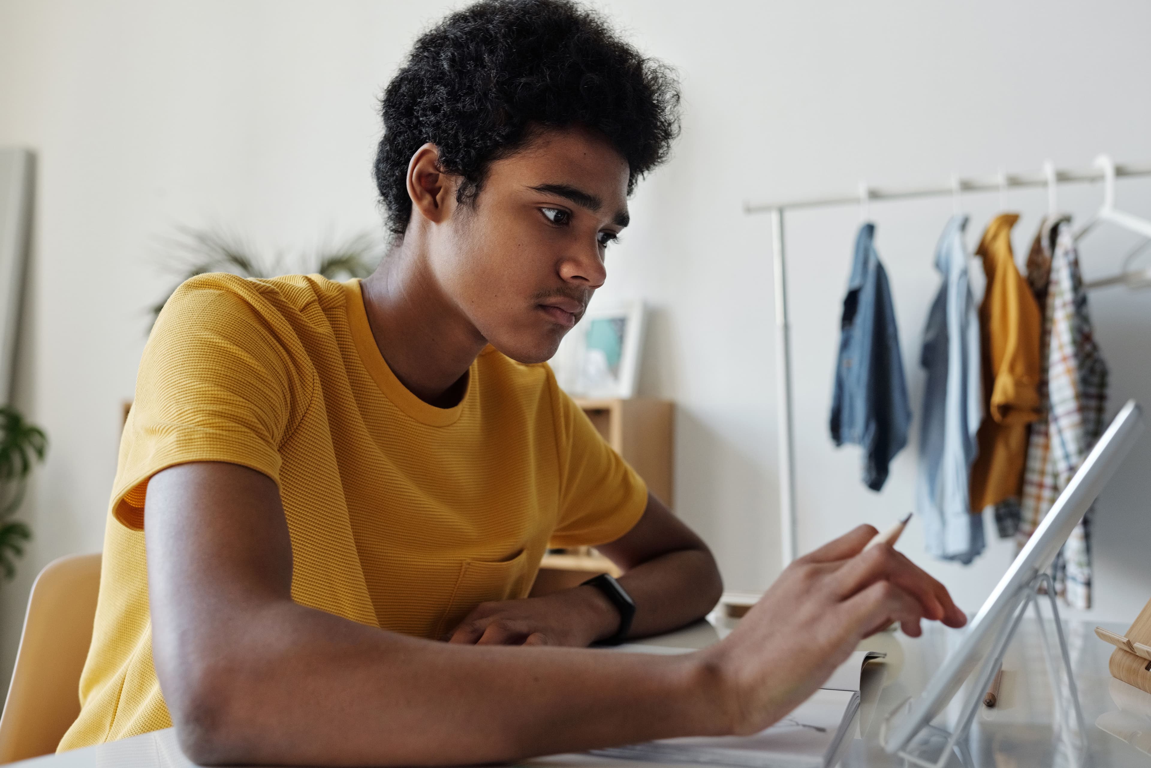 male student using tablet