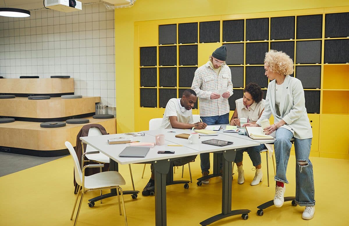 employees attending an employee resource group meeting, working at table