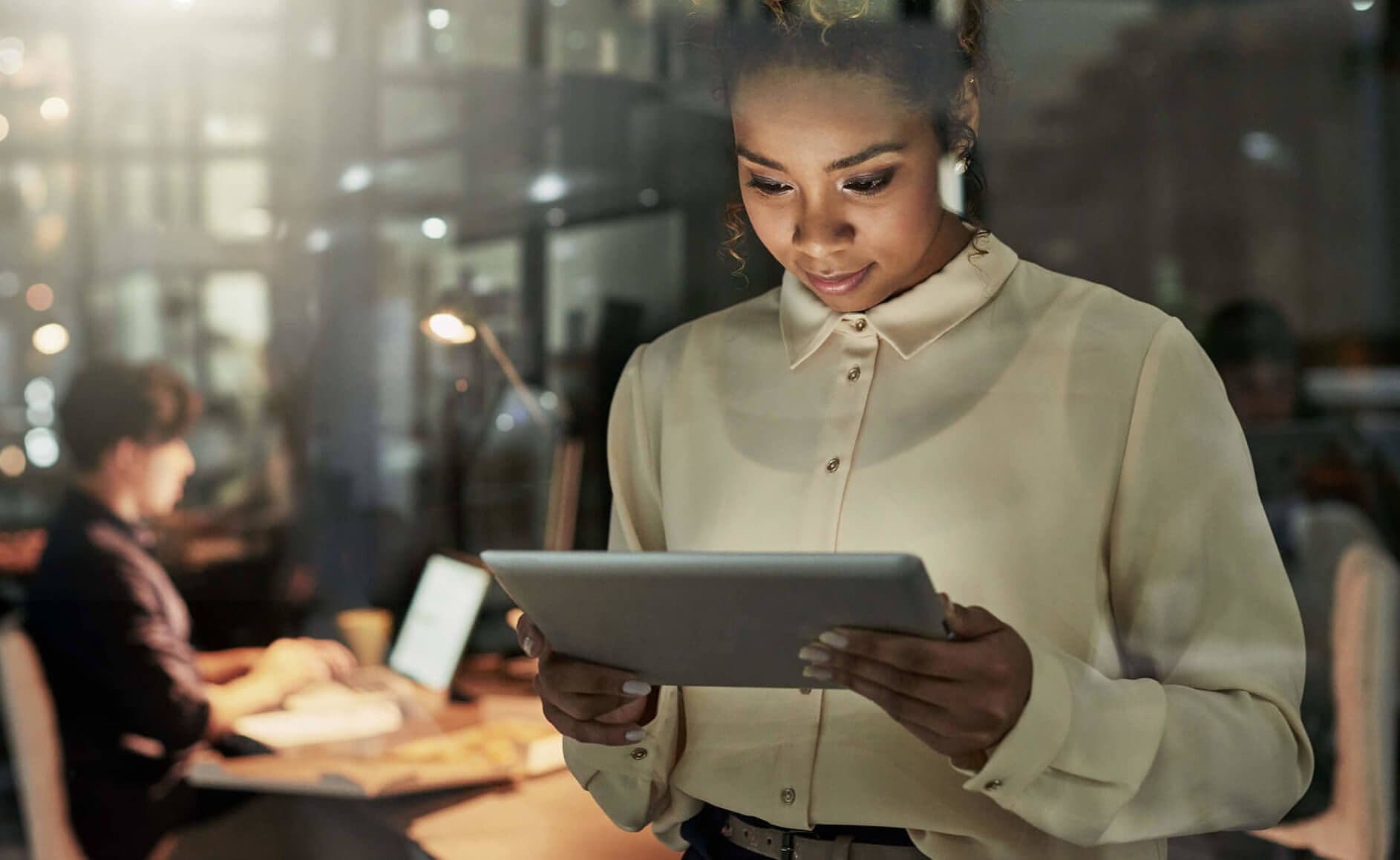 black woman using her tablet to connect with her mentor