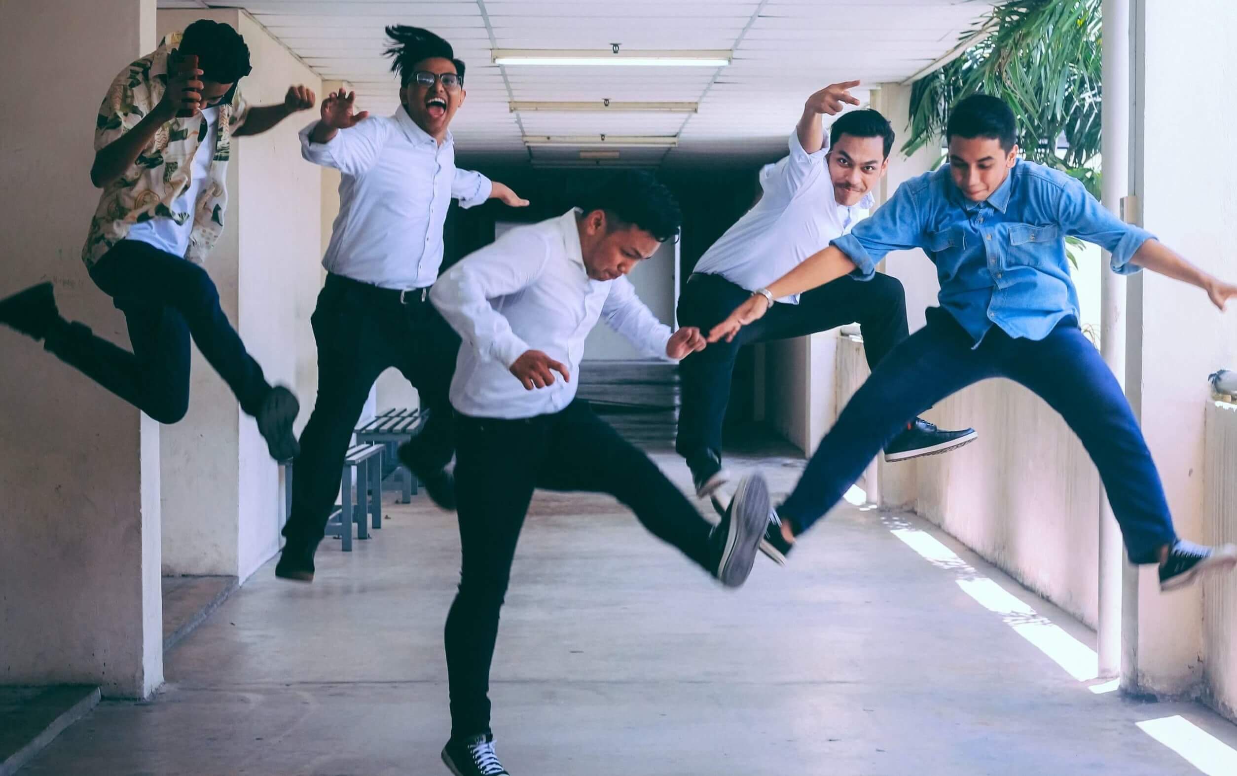 five men jumping in the air