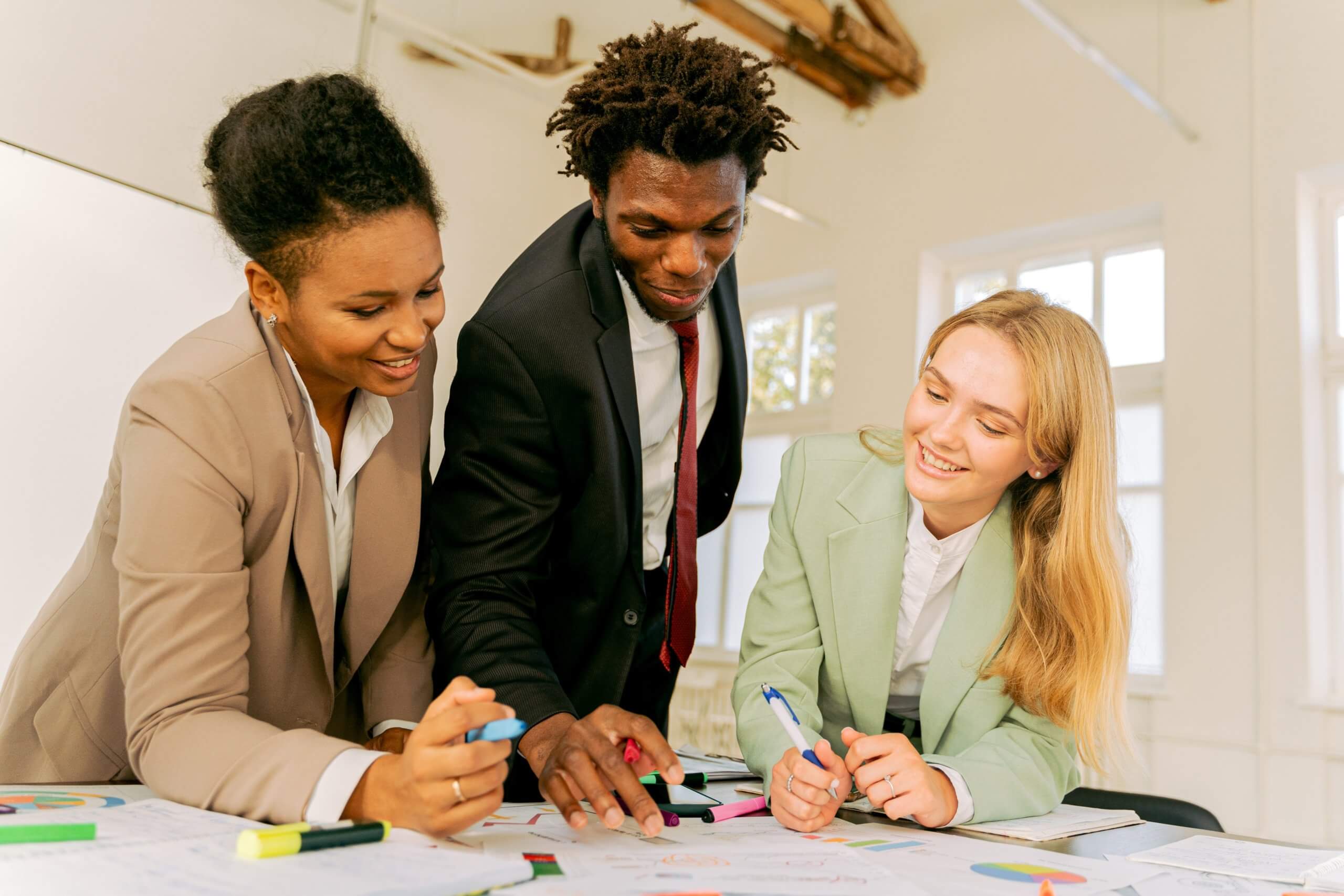 Employees discussing how to build an effective dei mentoring program at work