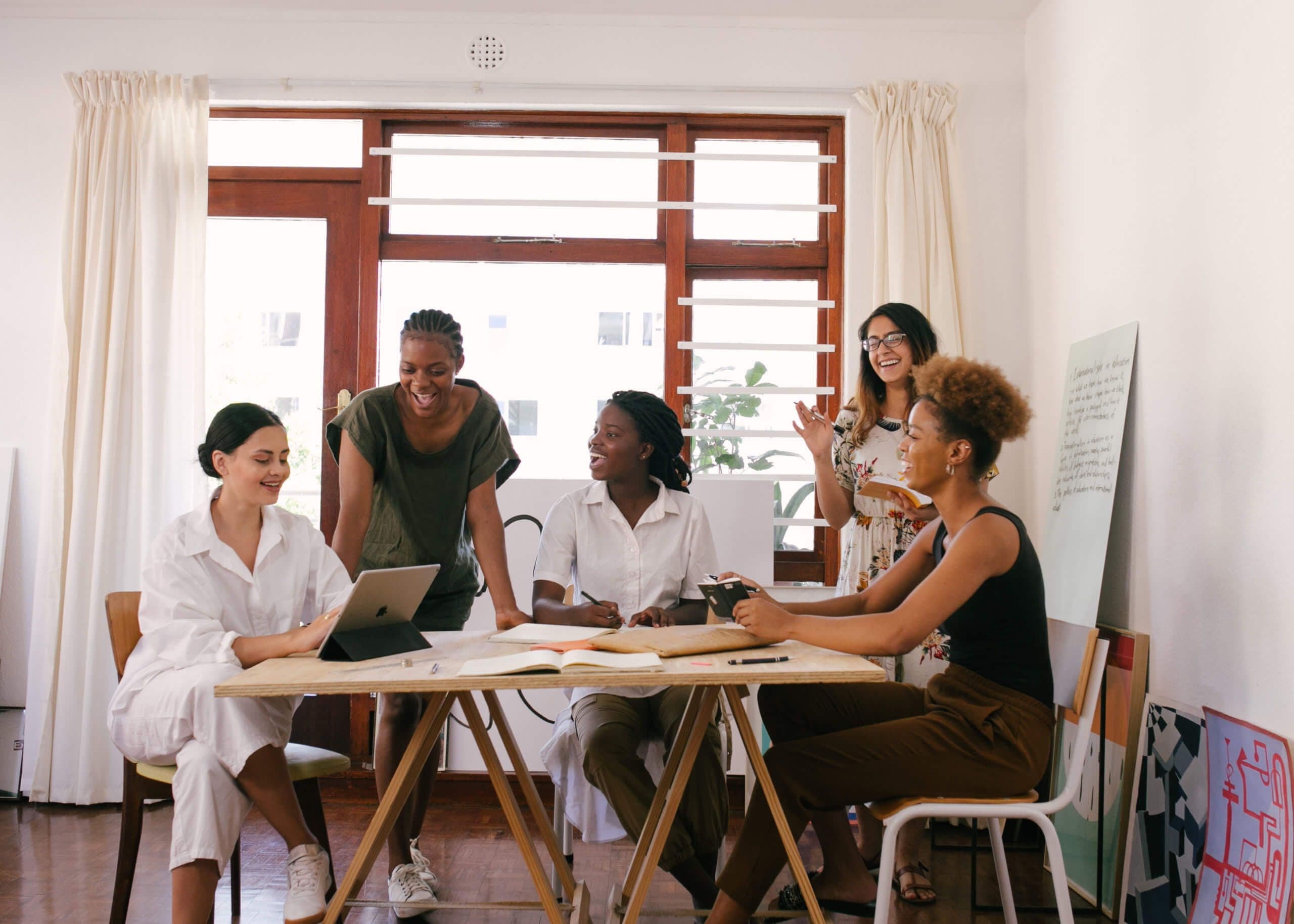 group of diverse women in mentoring program meeting