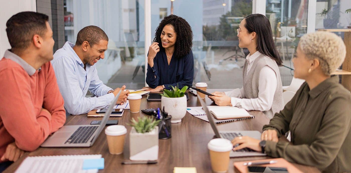 Team discussing the benefits of professional development in the workplace